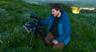 Astrophotographer Josh Dury with his camera kit on location at Glastonbury Tor