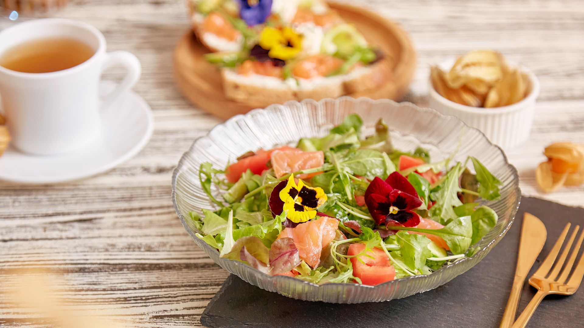 Table salad with floral garnishes