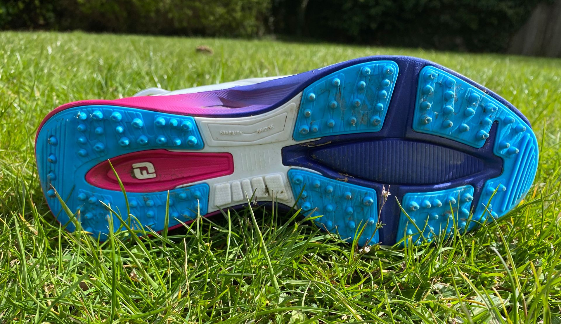 The sole of the FootJoy Fuel Sport 2023 Golf Shoe on a green background