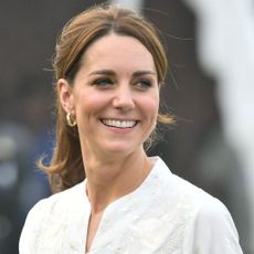 Kate Middleton smiles during a visit to the National Cricket Academy in Lahore, Pakistan