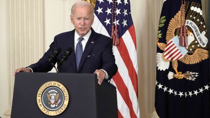 President Biden speaking at a podium 