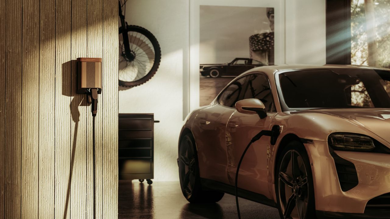 The Simpson &amp; Partners Home EV Charger, plugged into a Porsche EV