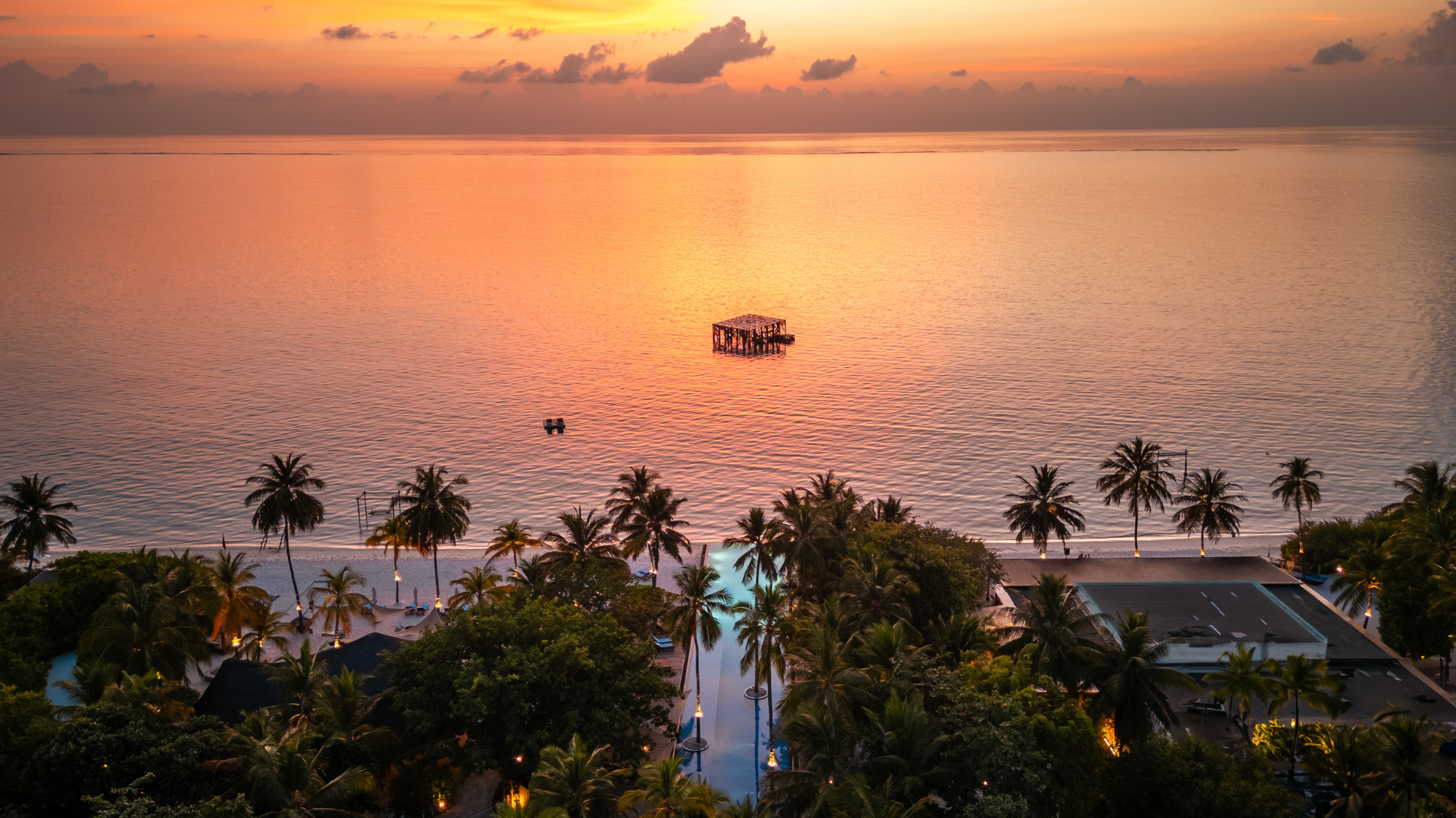 Sirru Fen Fushi view from island at sunset.