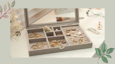 image of a jewellery box with multiple compartments showing how to store jewellery