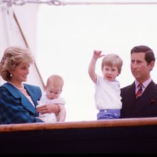 Diana Princess of Wales and Charles Prince of Wales hold Prince Harry and Prince William on the deck of the Royal Yacht Britannia