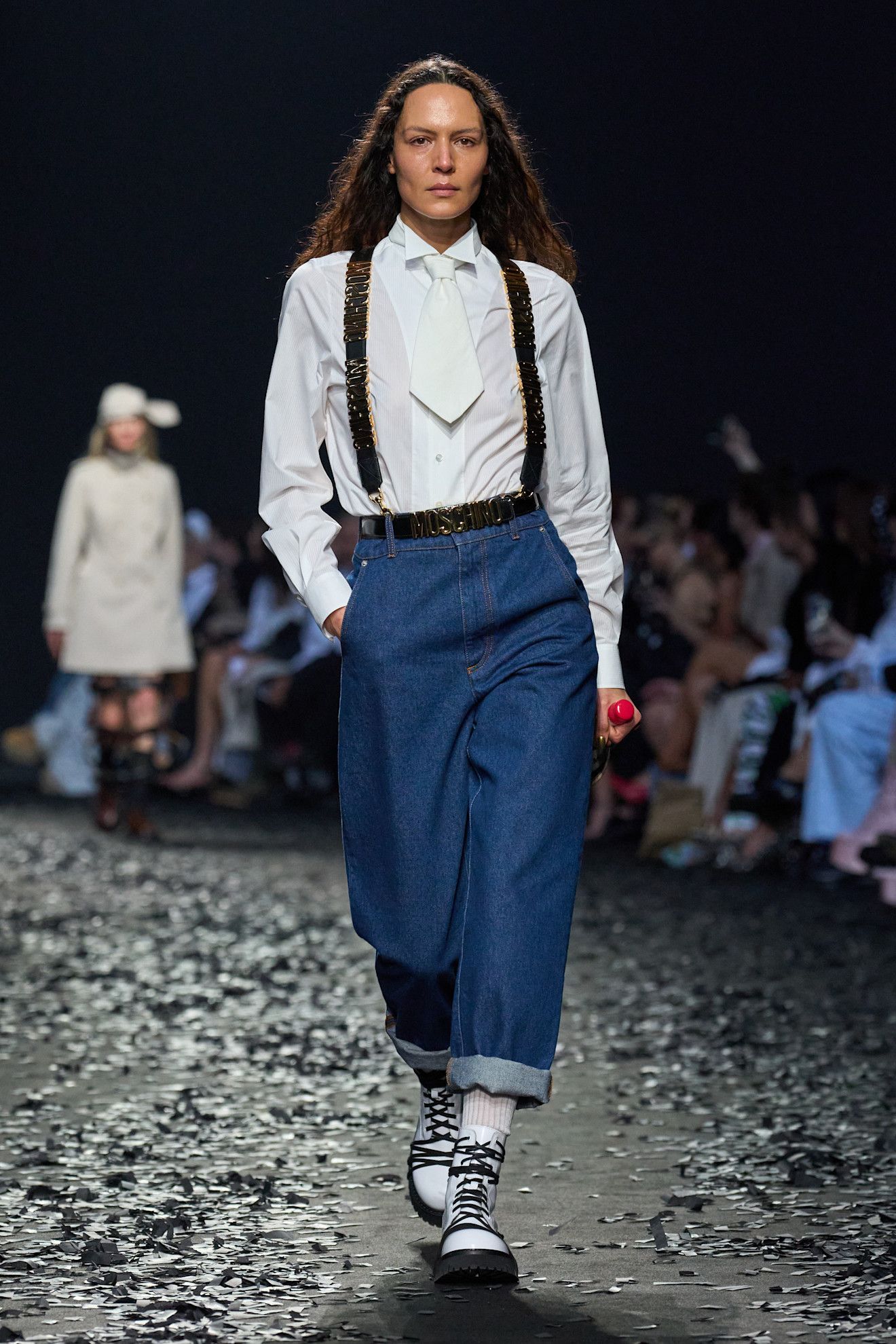 Model on the runway wearing cropped jeans controversial denim trend.