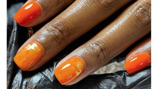 A tangerine marble nails design by nail technician Sophie Louise Martin