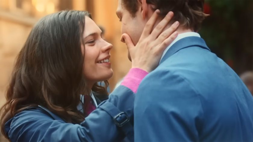 Maxton Hall Stars Harriet Herbig-Matten and Damian Hardung prepare to kiss in Season 2 uniforms.