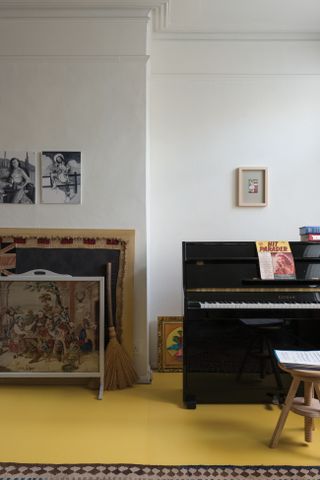 Living room with yellow painting floorboards