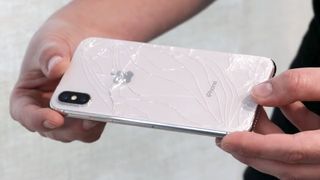 iPhone X with cracked screen
