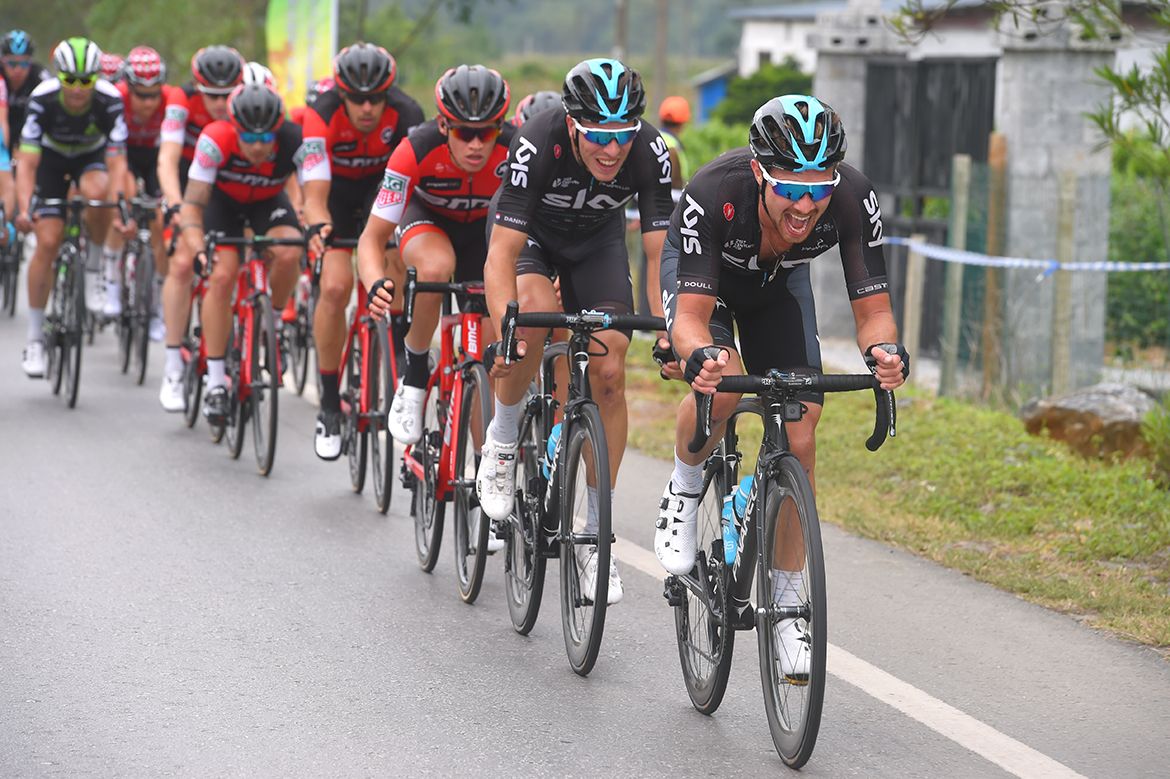 Team Sky lead the bunch on the approach to the climb