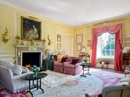 Fig 2: The drawing room with 17th-century-style panelling and a neo-Classical chimney piece with the portait of Rachel, Countess of Dudley. &copy;Paul Highnam for Country Life