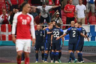 Finland players celebrate their goal against Denmark at Euro 2020.