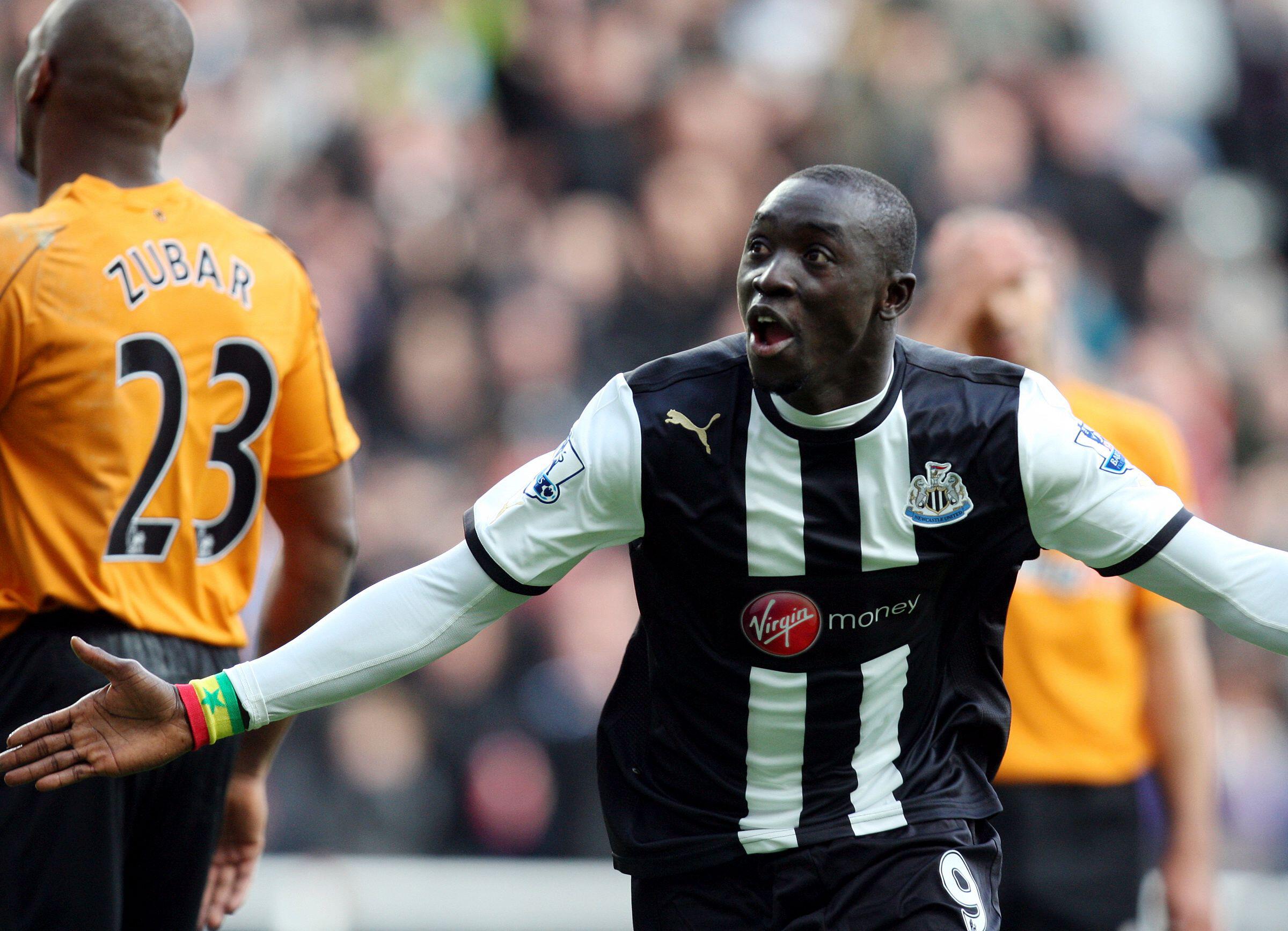 Papiss Cisse celebrates after scoring for Newcastle against Wolves, February 2012