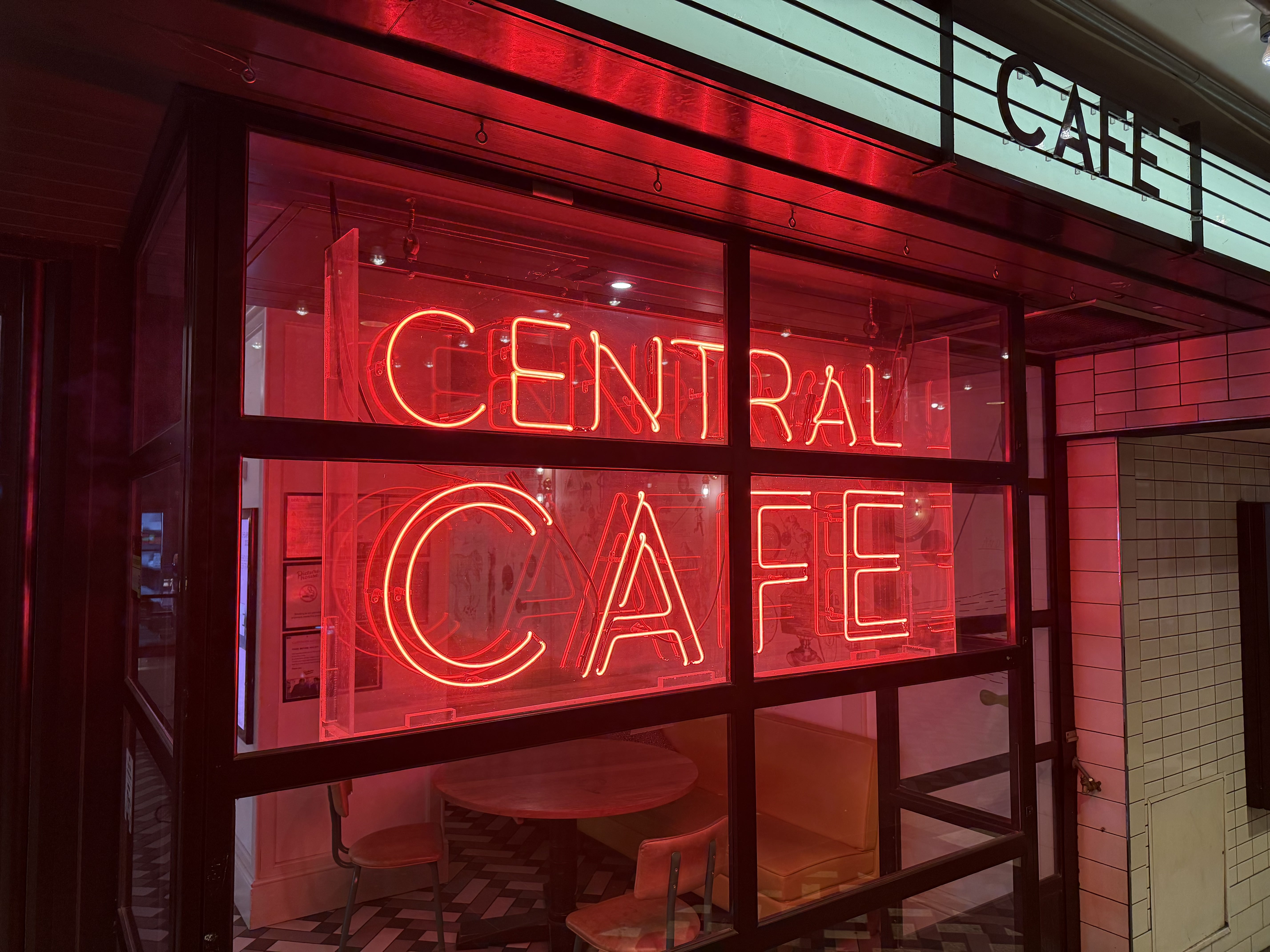 iPhone 16 Pro camera sample neon sign low light