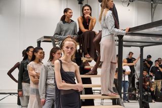 models on a platform during a rehearsal for a fashion show