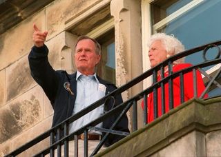 George H Bush and Barbara Bush watch The Open of 1995 at St Andrews. Credit: Getty Images.. Golf and Us Presidency