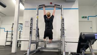 The author performs a chin-up