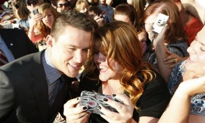 Channing Tatum poses for a picture with a female fan at the Magic Mike premiere: 73 percent of the film's opening-weekend audience was composed of women.