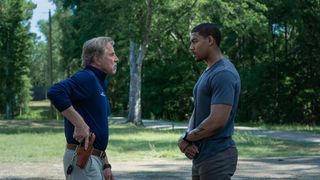 Characters Terry Richmond and Sandy Burrne stand face to face in Netflix&#039;s Rebel Ridge 