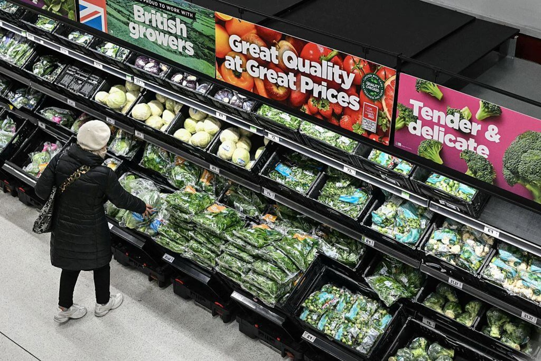 A person is shopping for vegetables in the supermarket