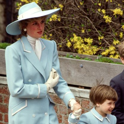 Princess Diana and Prince William wearing blue coats on Easter 1987