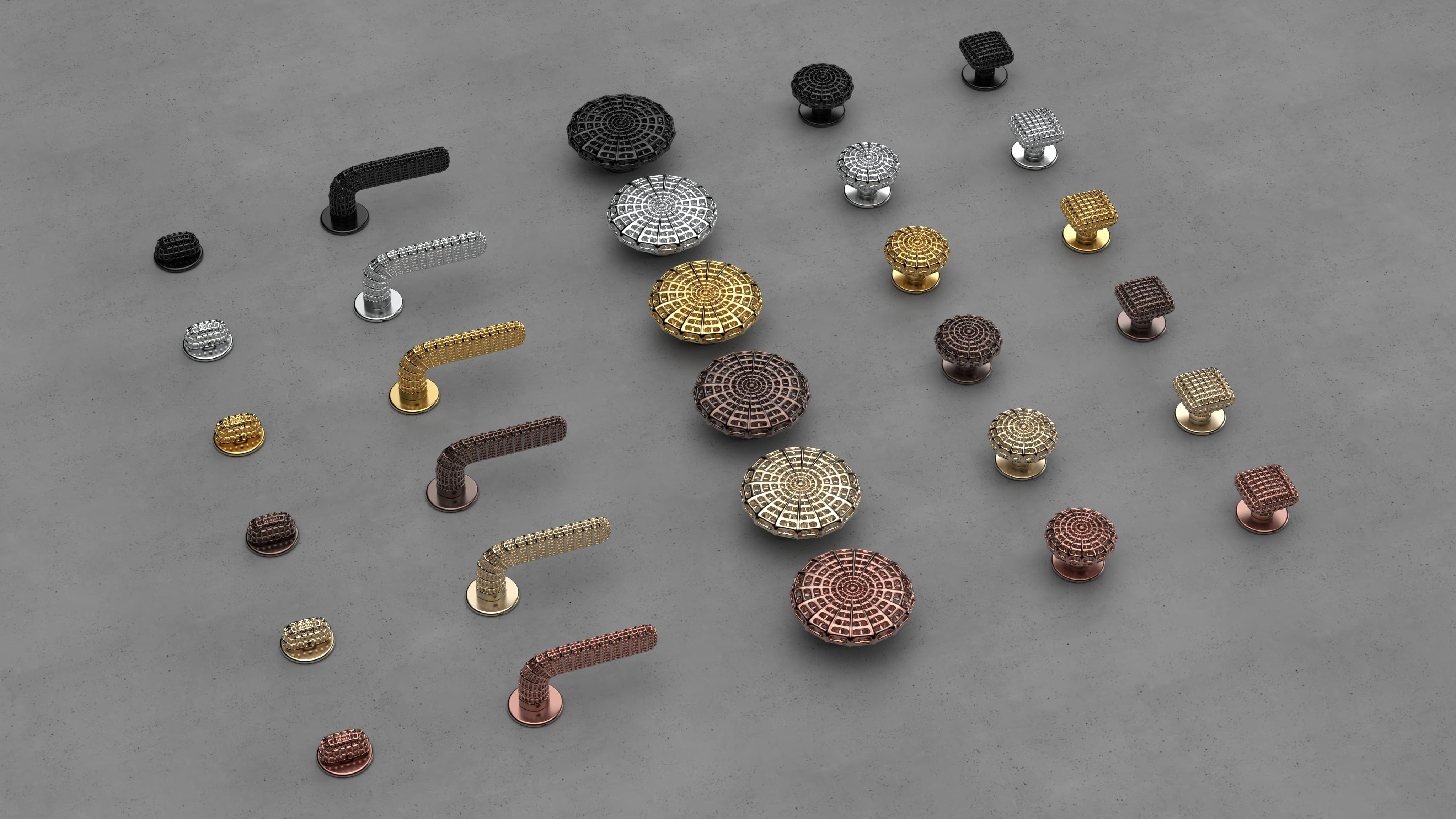 metal handles and knobs laid out on flat, white surface