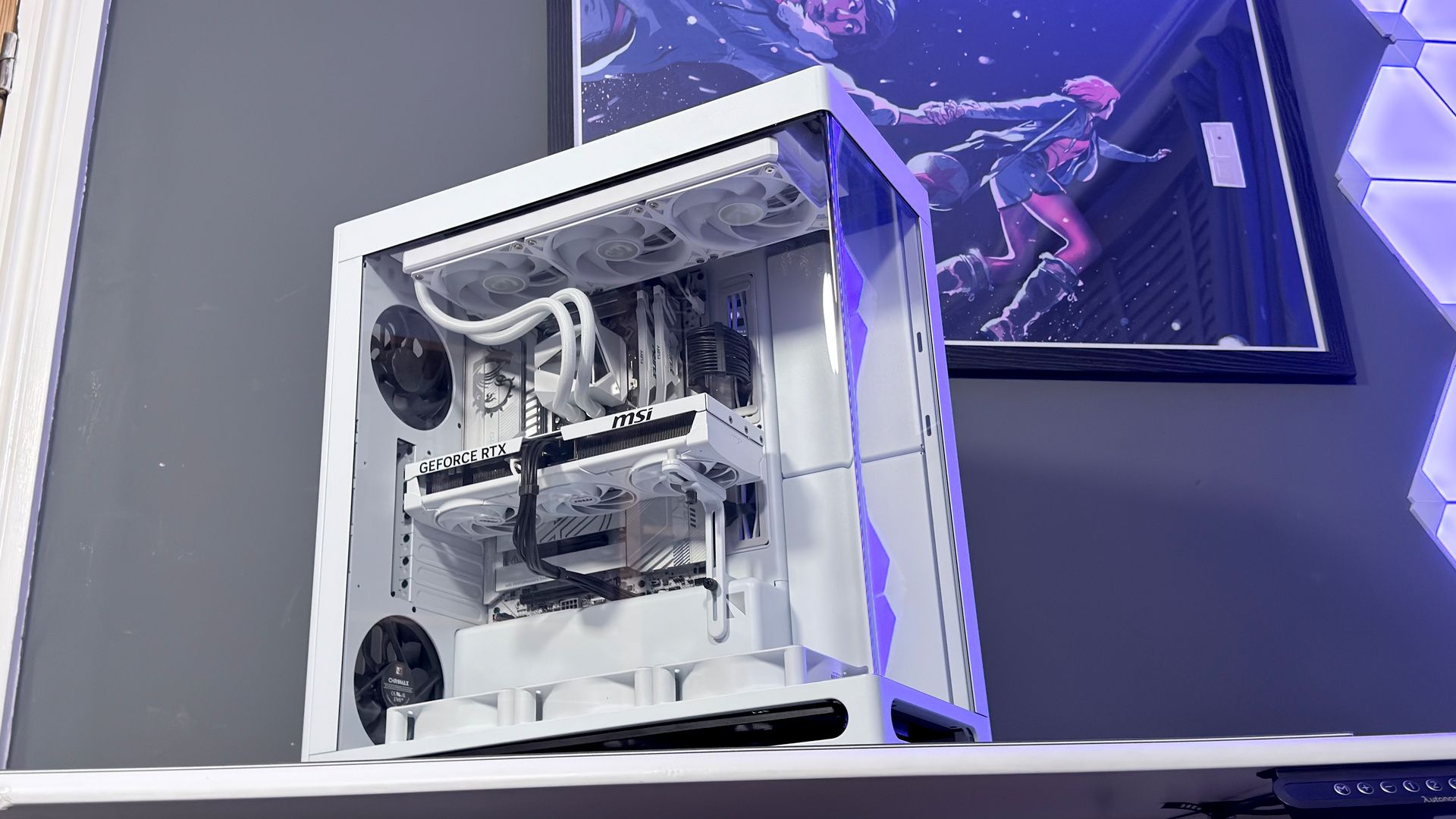 The Havn HS 360 PC case in black and white on a desk.