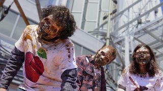 Walkers dressed in NYC t-shirts taking over the streets of New York ahead of The Walking Dead: Dead City season 2 premiere.