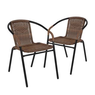 Two dark brown rattan woven chairs with black legs