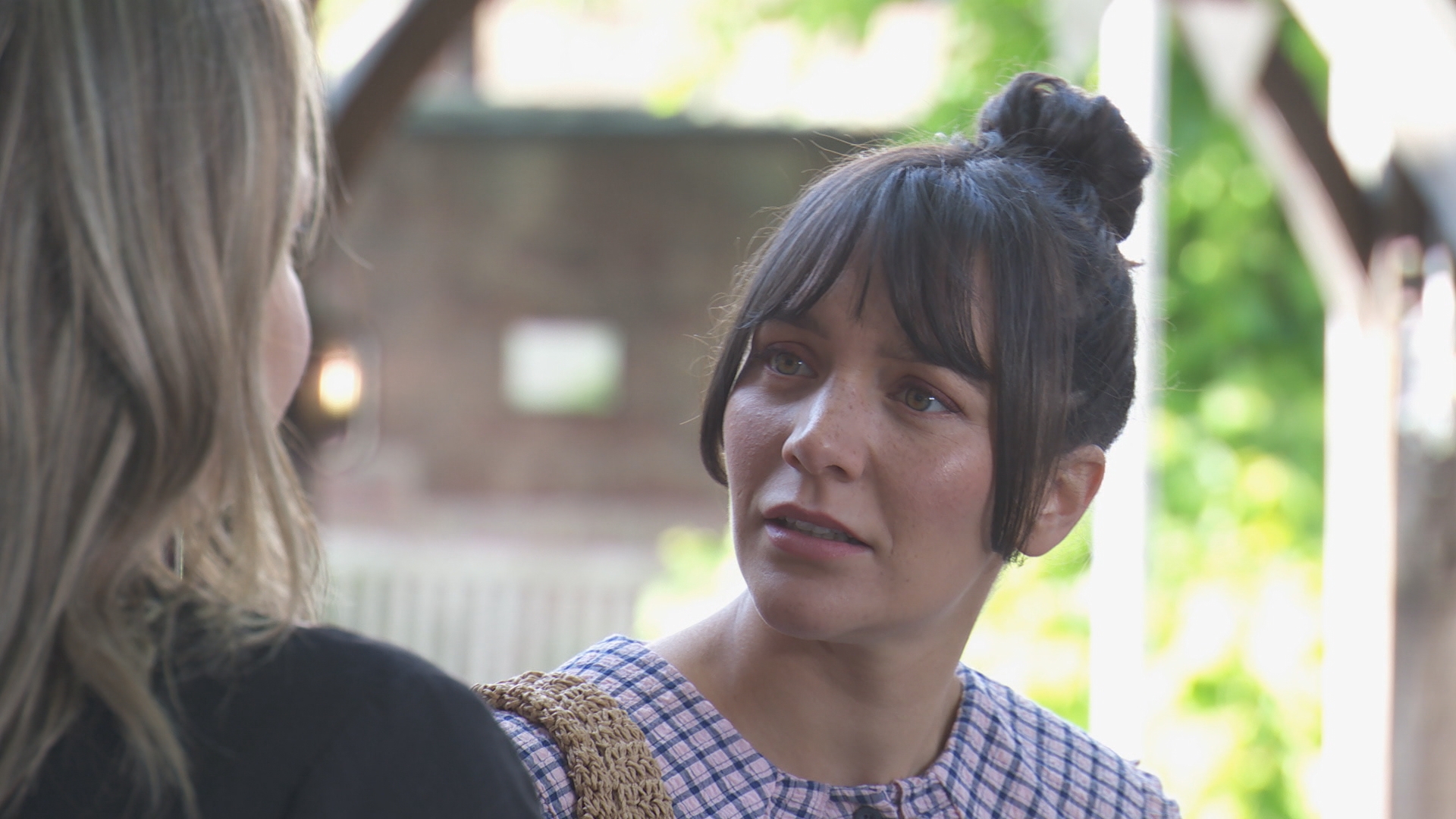 Cleo McQueen talking to Marie Fielding.