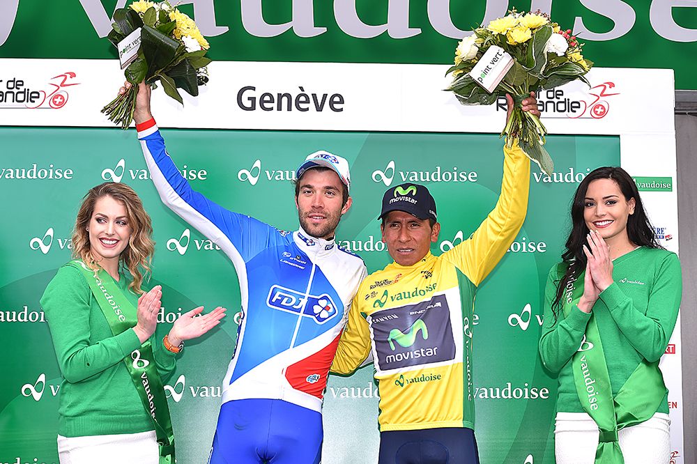 Thibaut Pinot (FDJ) and Nairo Quintana (Movistar) salute from the podium of the Tour de Romandie.