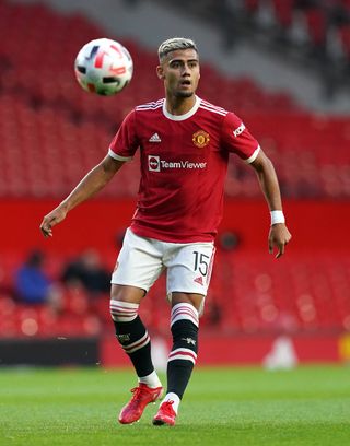 Manchester United's Andreas Pereira is pictured on the field with the ball in the air.