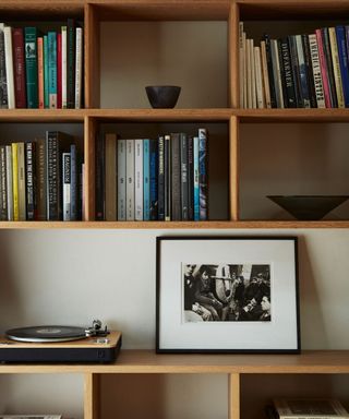 dining room shelves with books and turntable