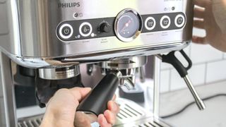 Inserting a portafilter into the Philips Barista Brew Espresso Machine