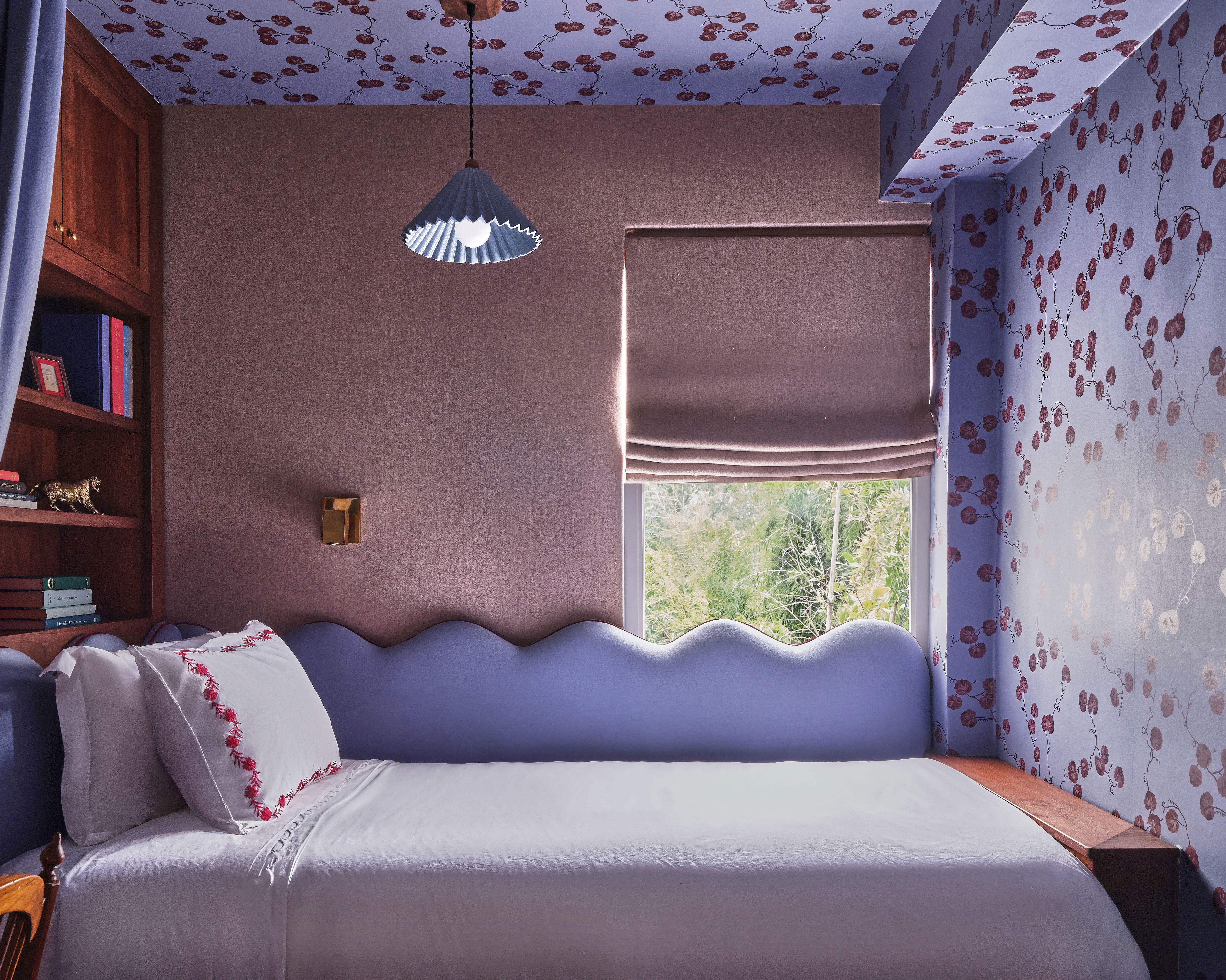 purple guest bedroom with purple patterned wallpaper