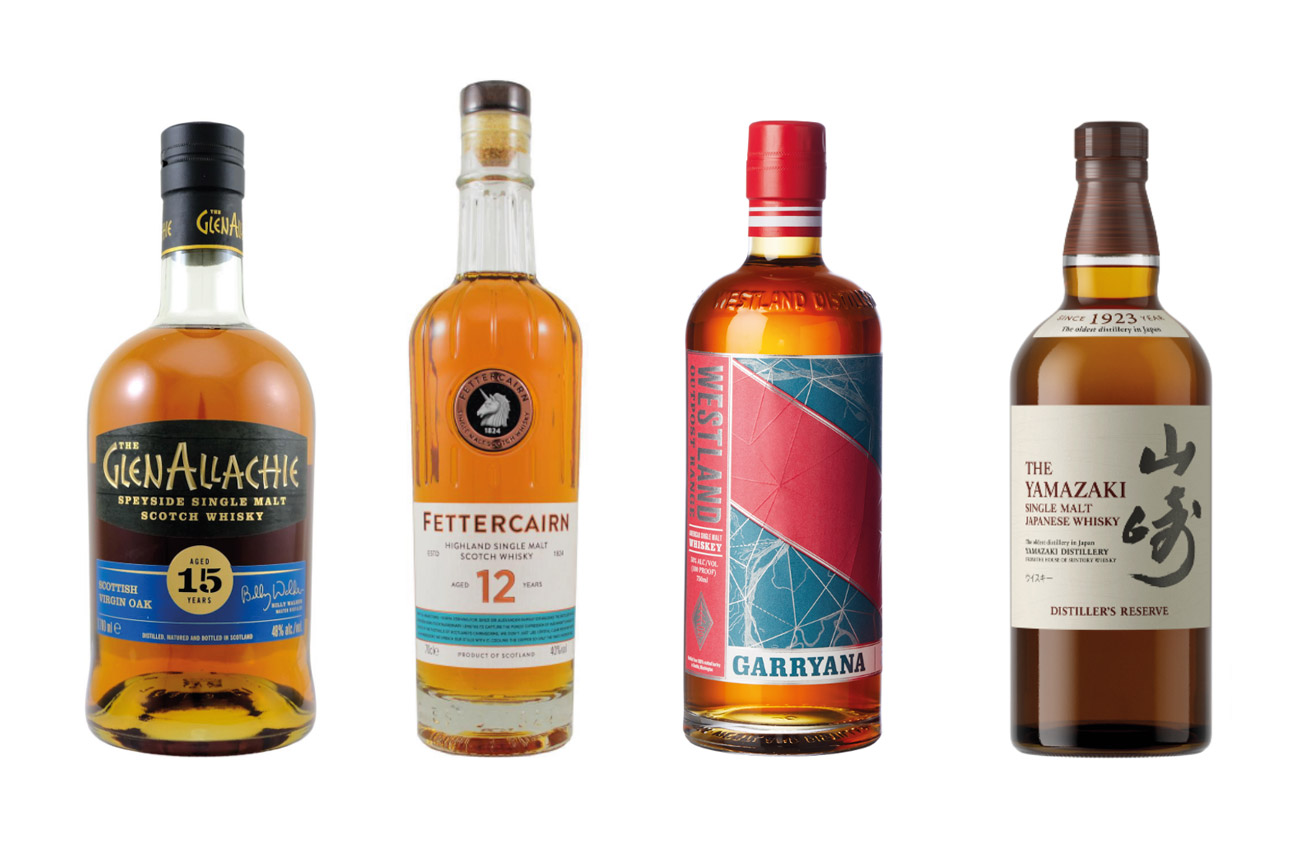 Four bottles of whisky against a white background