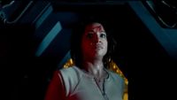 a frightened woman with blood on her forehead