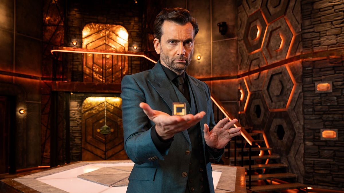 David Tennant poses on set for Genius Game in a blue suit