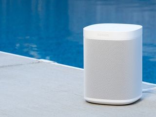 Sonos One in white next to a pool