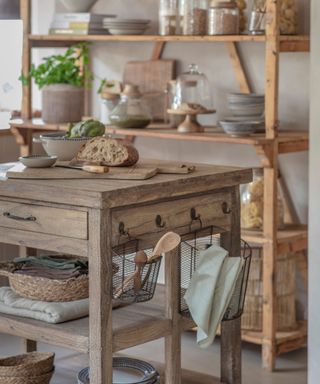 wooden freestanding items of kitchen furniture including shelving and kitchen island