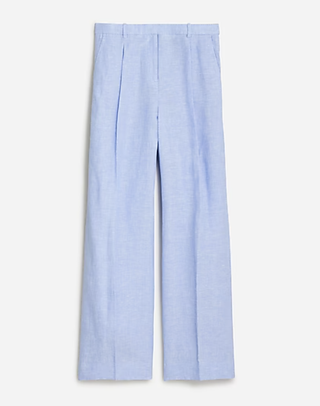 a pair of wide leg linen pants from jcrew in front of a plain backdrop