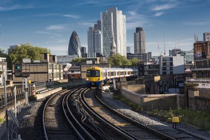 Train leaving the city, London, UK