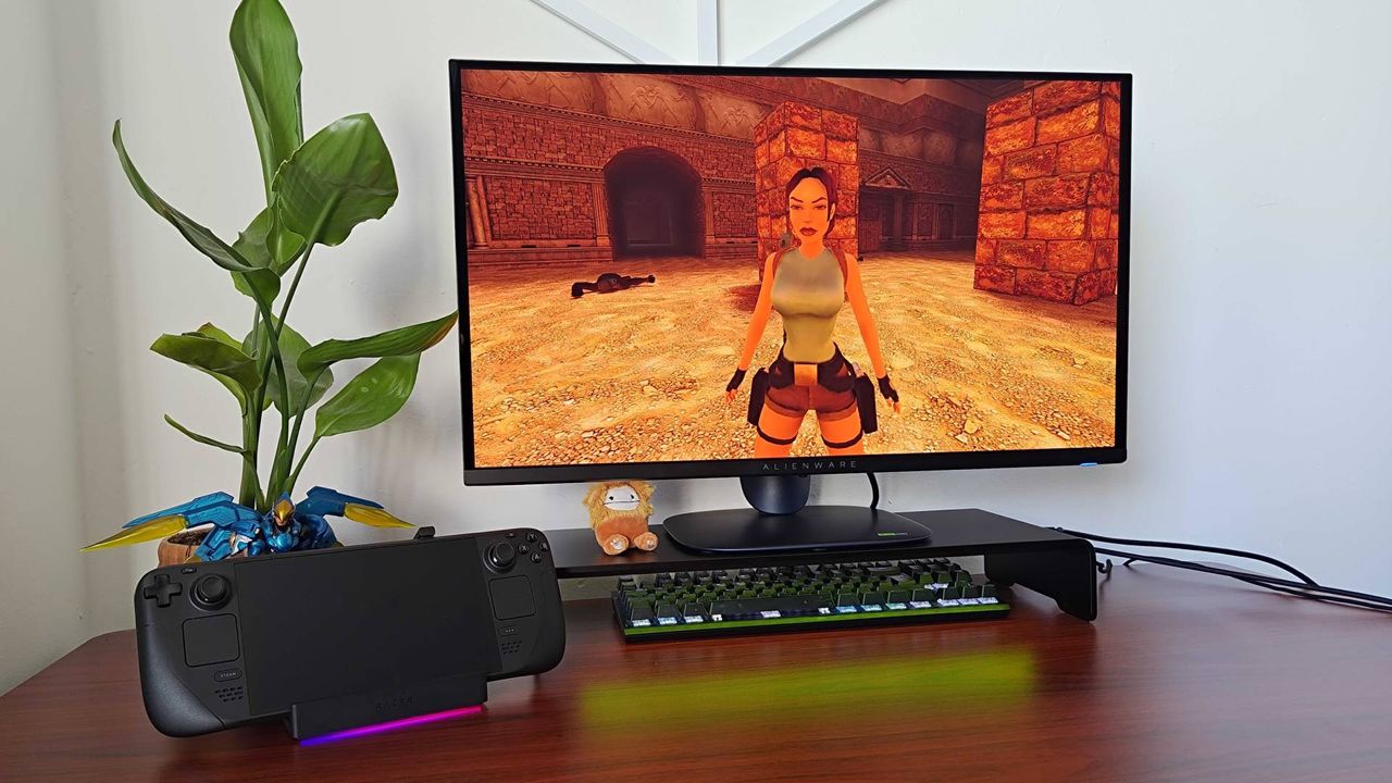 Razer Handheld Dock Chroma with Steam Deck attached and Tomb Raider Trilogy gameplay on screen.