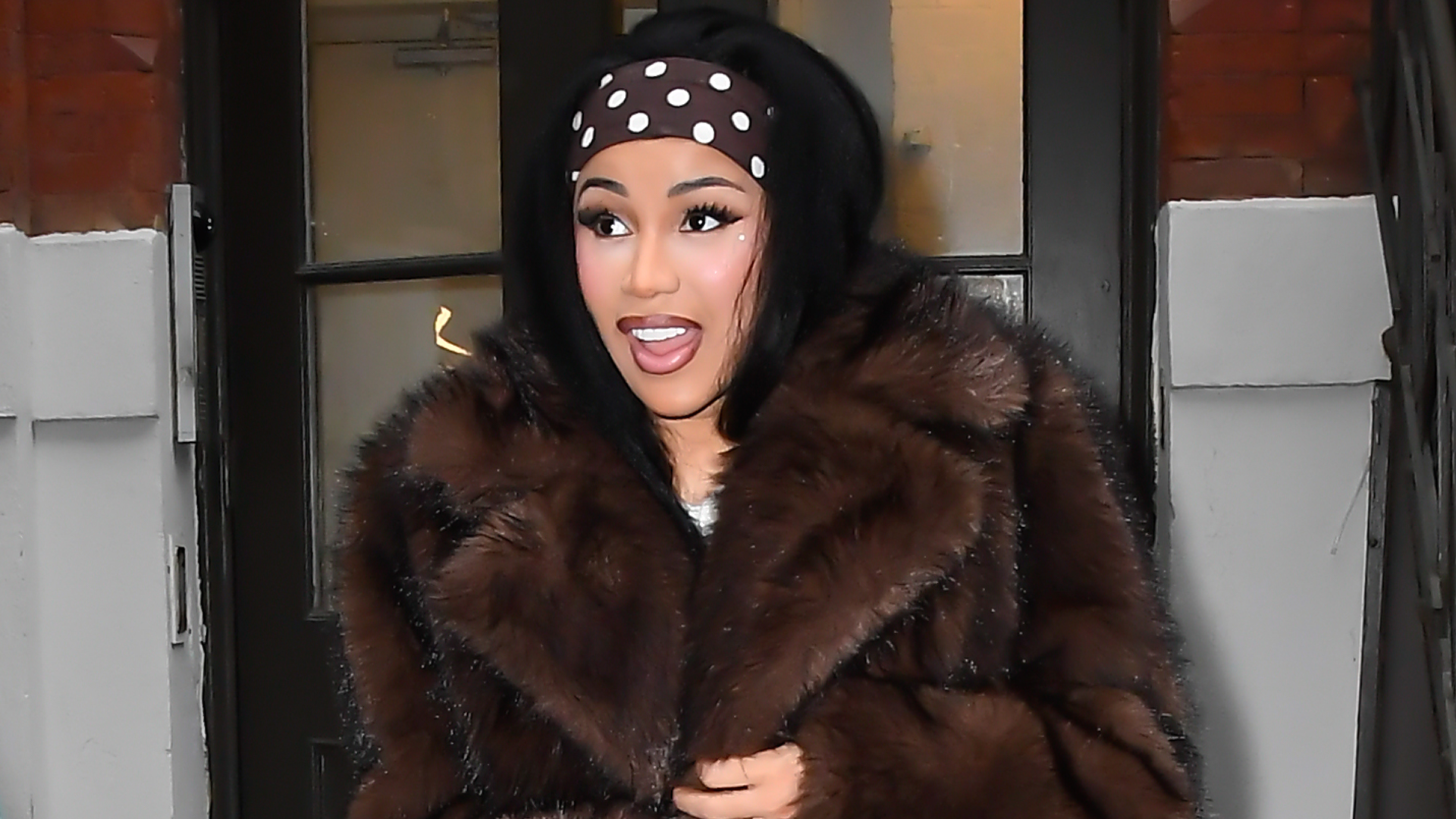 Cardi B was seen in New York City wearing a polka-dot take on the stirrup leggings trend, a matching dress, and headband