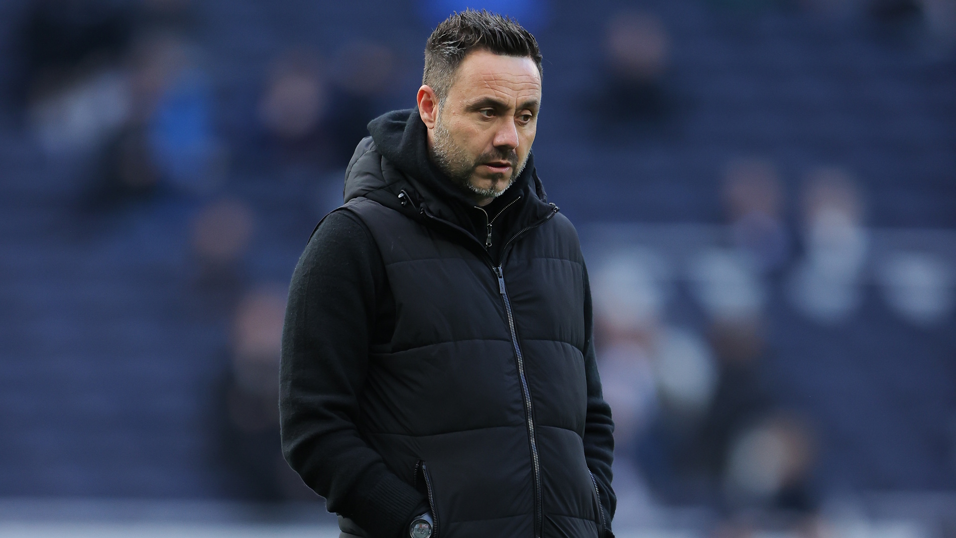 Roberto De Zerbi, head coach of Tottenham Hotspur, looking glum on the side-lines during a Premier League soccer match.
