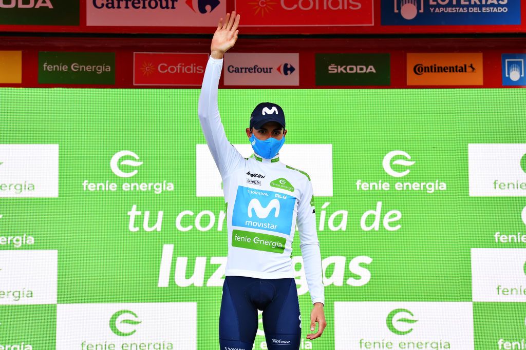 LEKUNBERRI SPAIN OCTOBER 21 Podium Enric Mas Nicolau of Spain and Movistar Team White Best Young Jersey Celebration Mask Covid safety measures during the 75th Tour of Spain 2020 Stage 2 a 1516km stage from Pamplona to Lekunberri lavuelta LaVuelta20 La Vuelta on October 21 2020 in Lekunberri Spain Photo by Justin SetterfieldGetty Images
