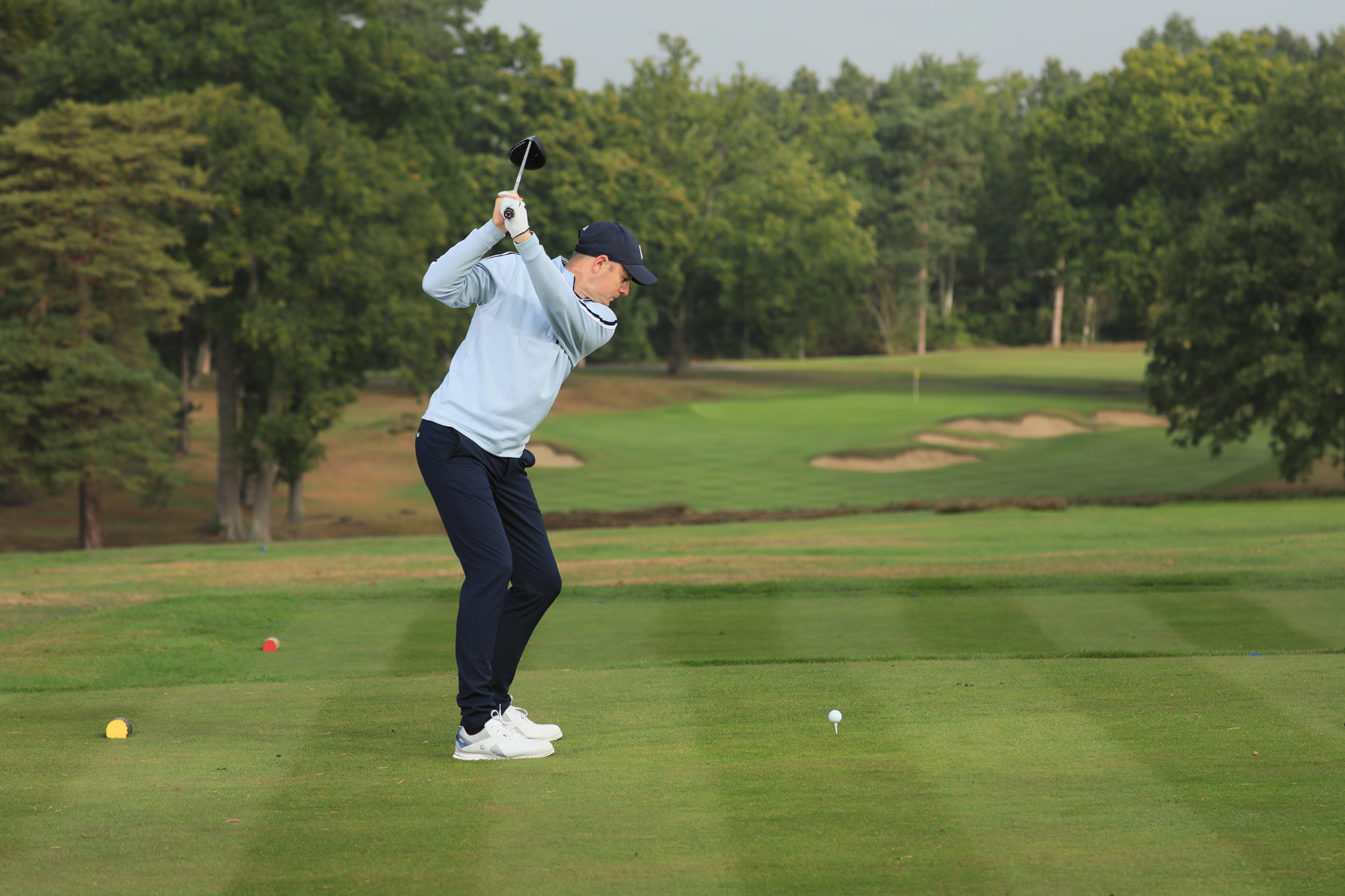 Neil Tappin at the top of his backswing about to hit driver on the tee box