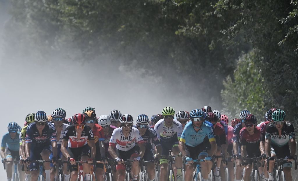 The pack rides through the countryside during the oneday classic cycling race Strade Bianche White Roads on August 1 2020 around Siena Tuscany Photo by Marco BERTORELLO AFP Photo by MARCO BERTORELLOAFP via Getty Images
