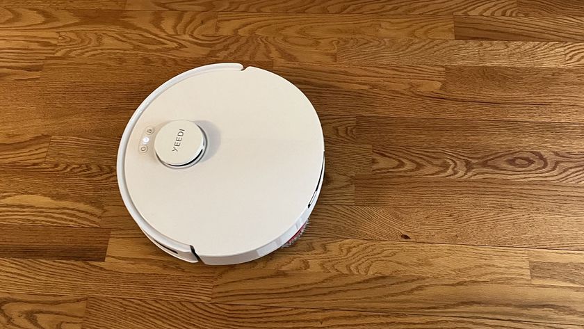 Yeedi M12 Ultra Plus robot vacuum on a wooden floor in reviewer&#039;s home